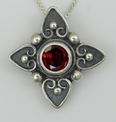 Sterling Silver Gathering of Hearts on This Necklace With Garnet